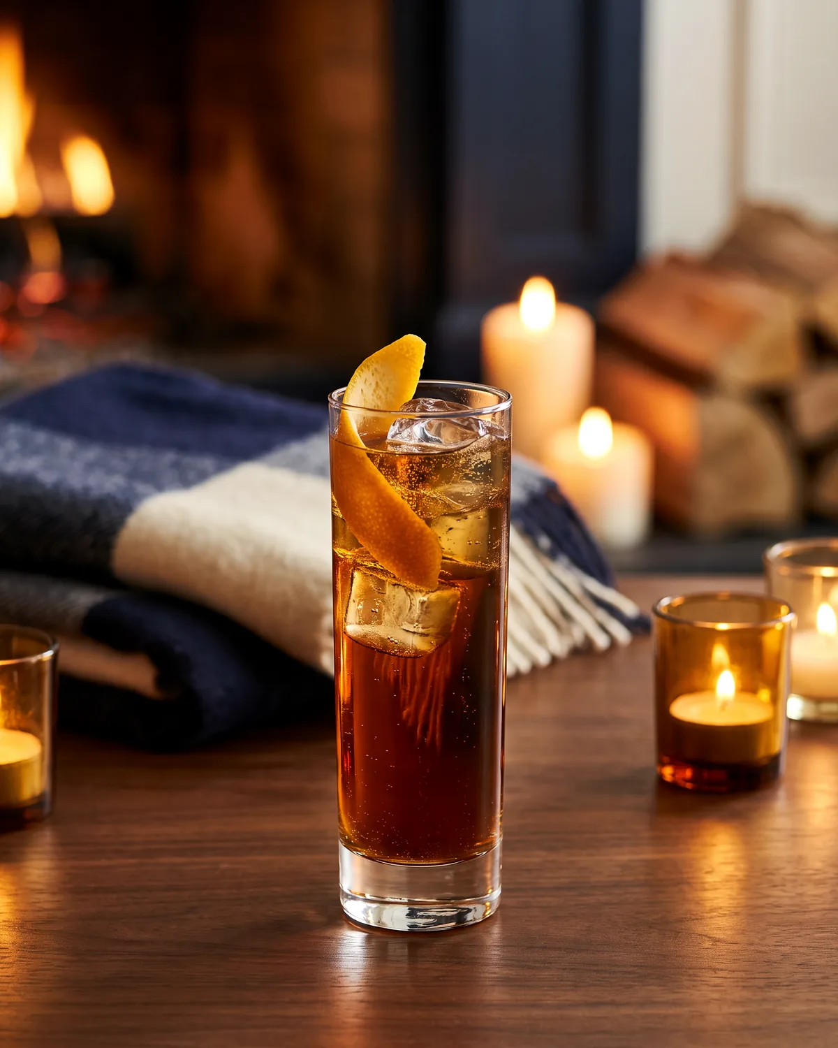 Rye Amaro Highball, made with ReVerb Rye, in a highball glass, garnished with orange peel