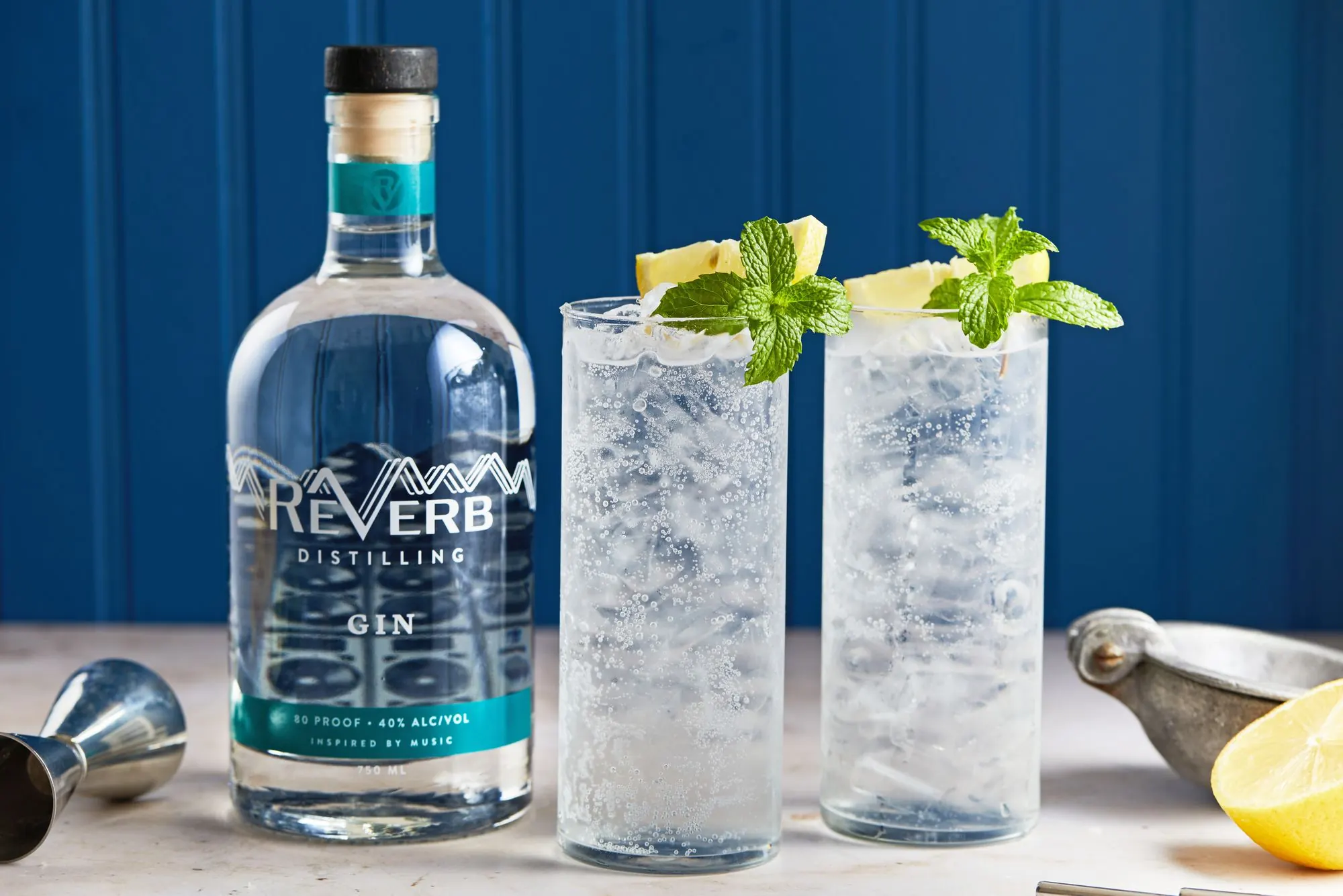 ReVerb Gin with gin and tonics on a blue background