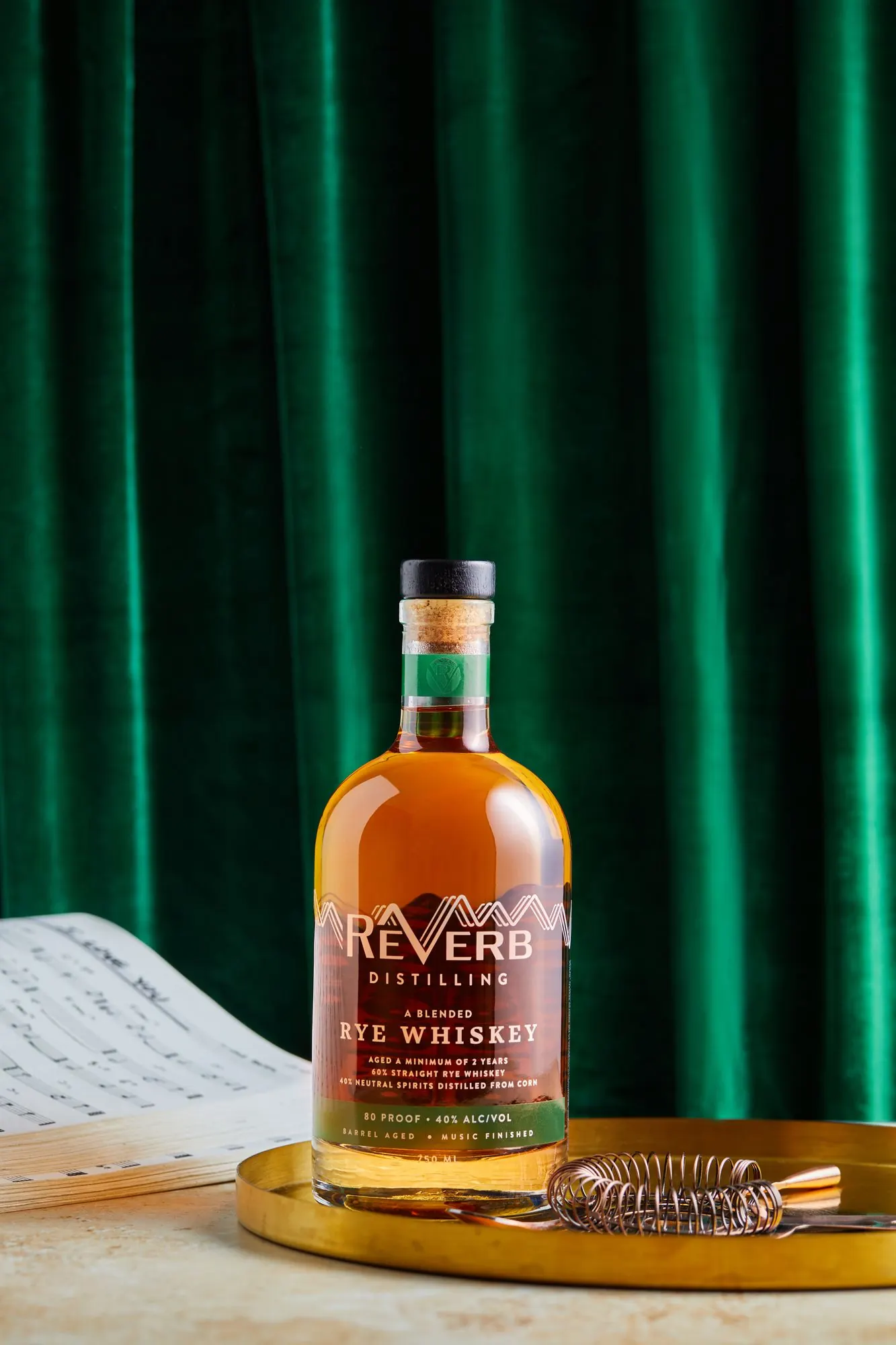 ReVerb Rye on a gold tray with a green velvet curtain