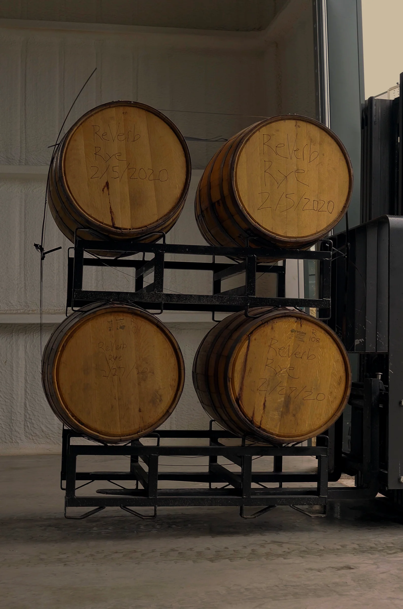 Barrels on steel racks in the ReVerb warehouse